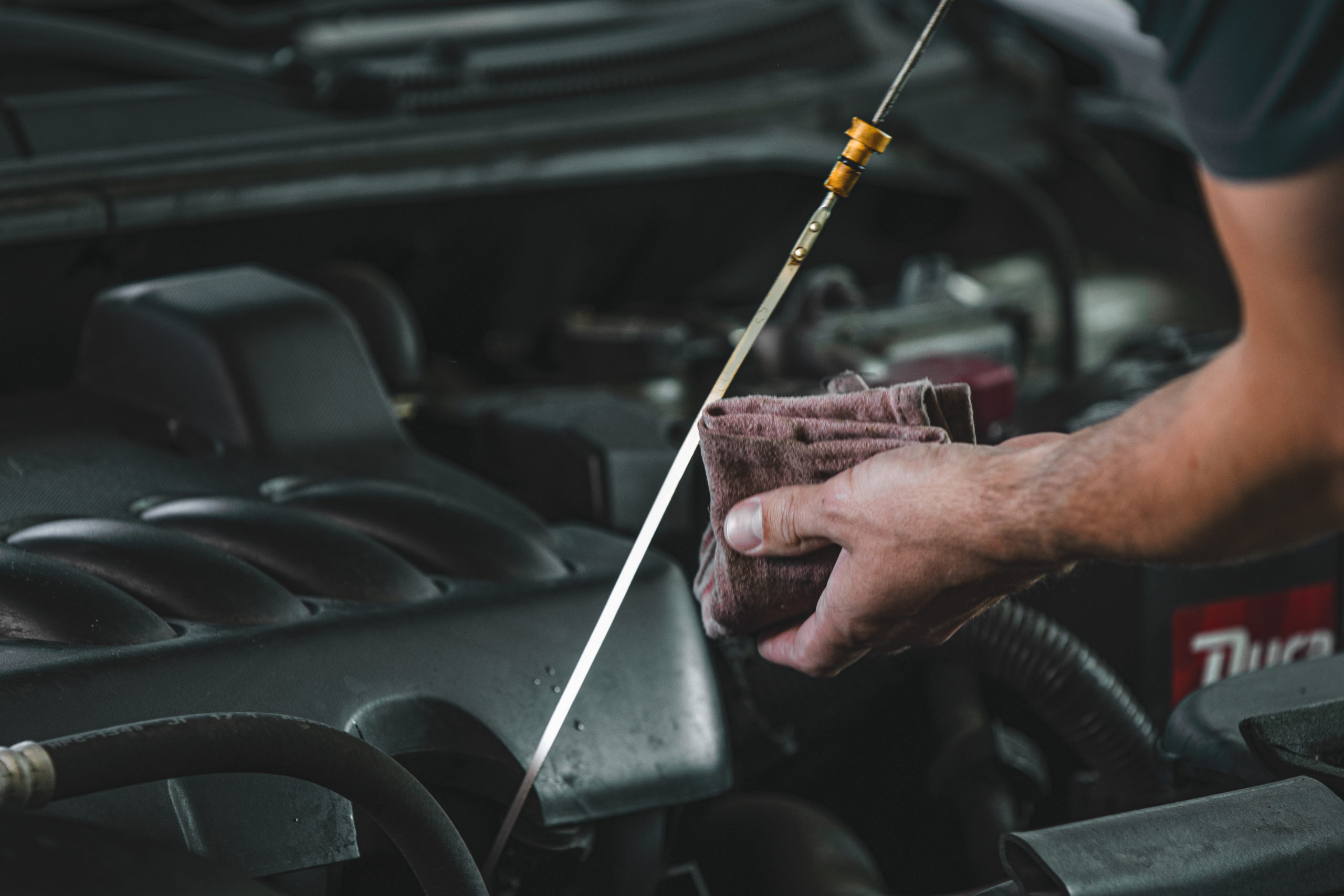 Checking engine oil dipstick